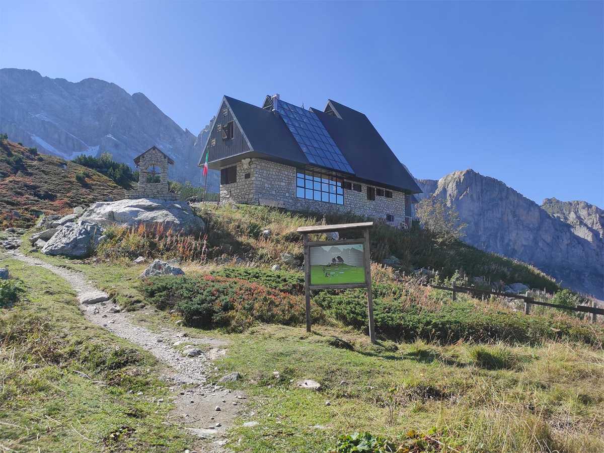 Rifugio Garelli mountain hut surrounded by alpine landscape