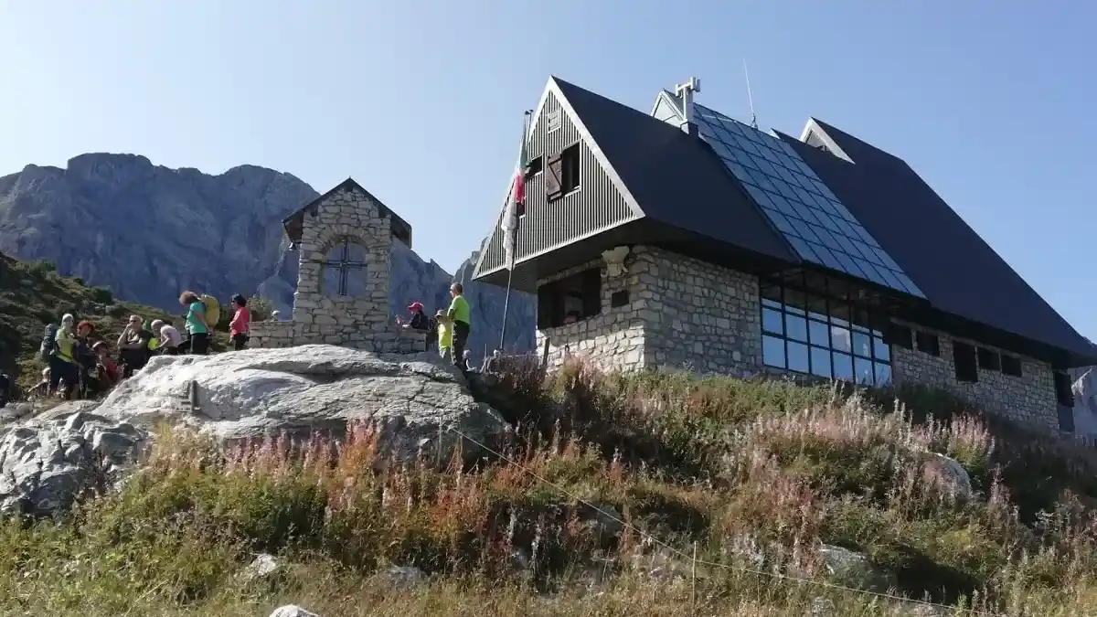 Father and son trekking to Rifugio Garelli in the Maritime Alps
